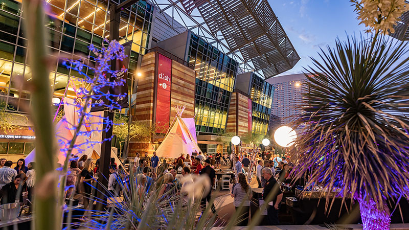Crowd attending an outdoor evening event