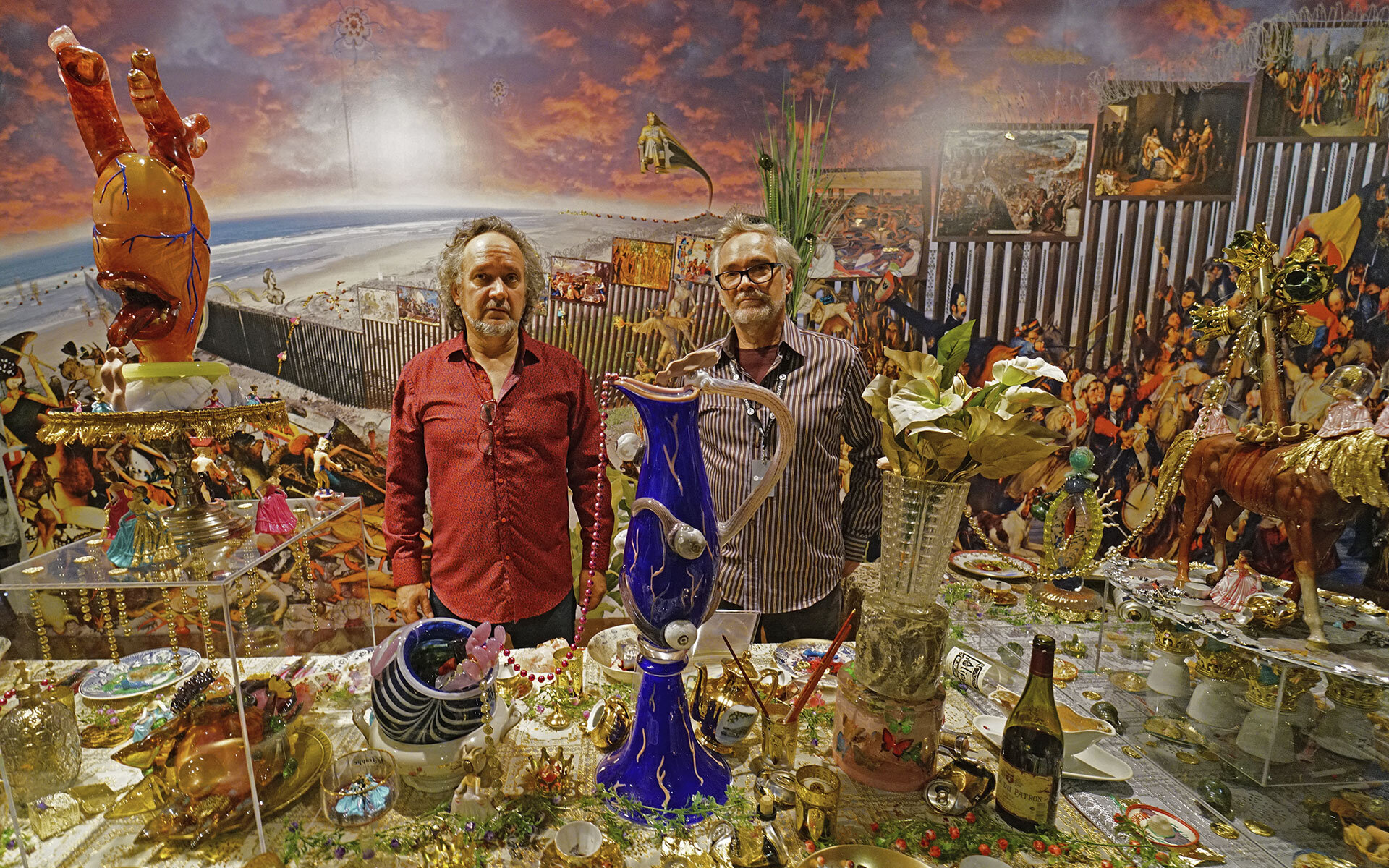 de la Torre brothers standing among their various art pieces