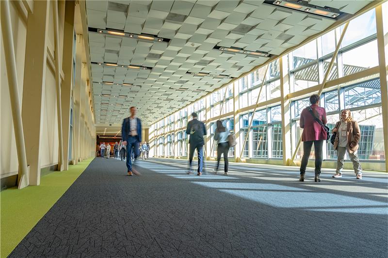 People walking across the bridge at the Phoenix Convention Center. 