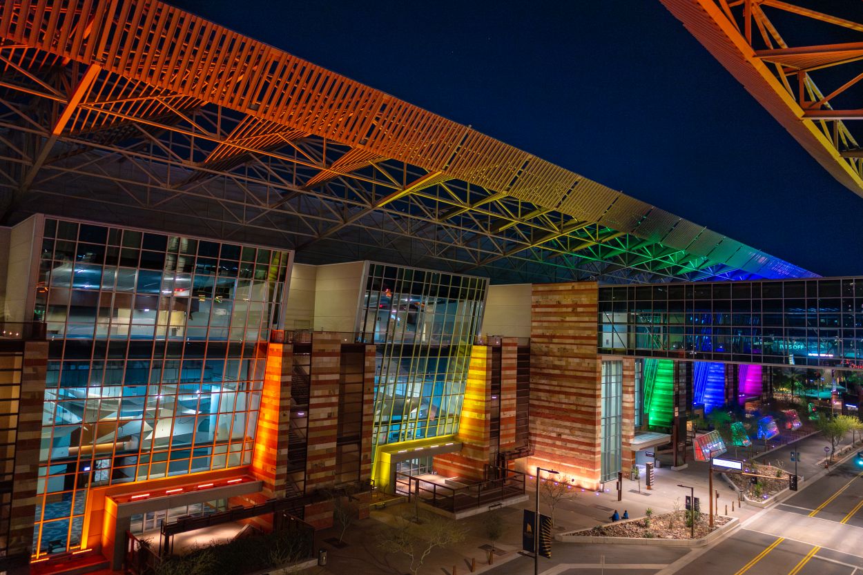 Exterior lighting installation at night, showcasing different color customizations.