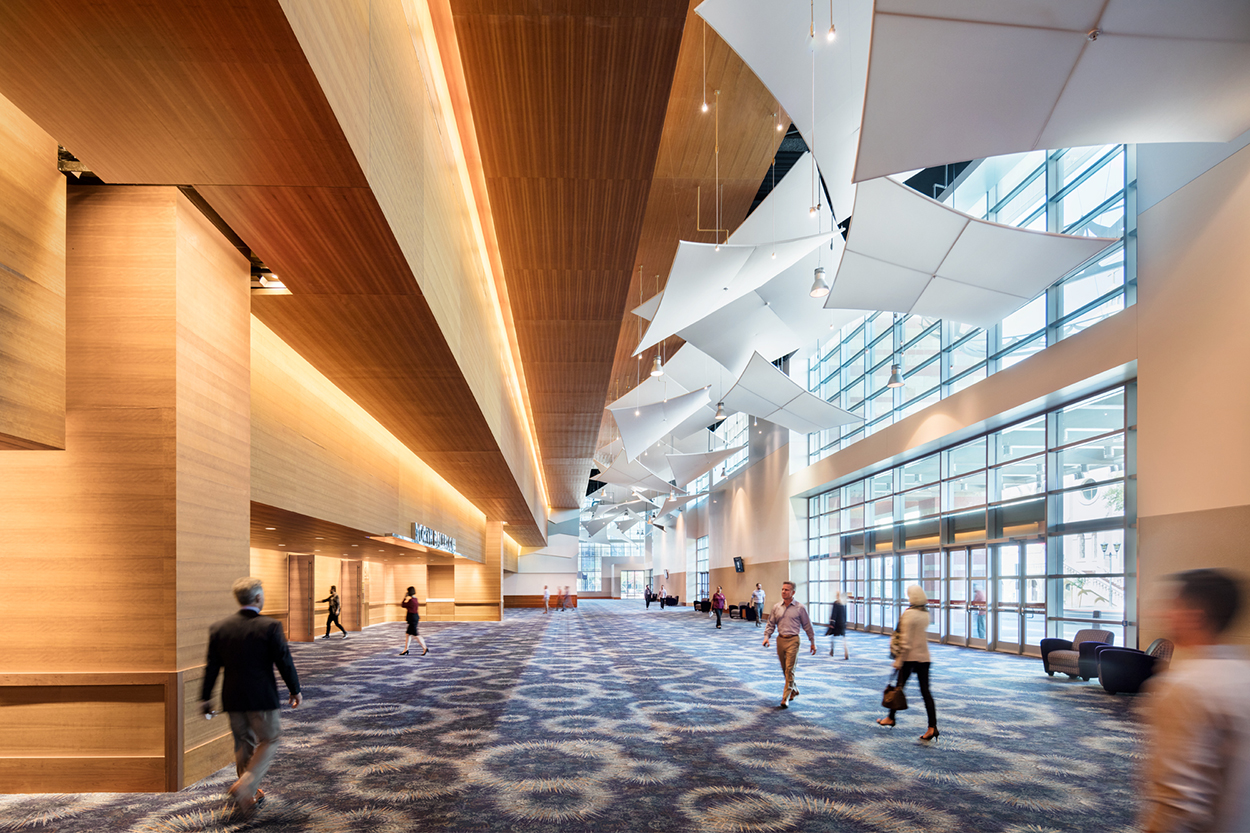 Ballroom pre-function space with attendees walking around