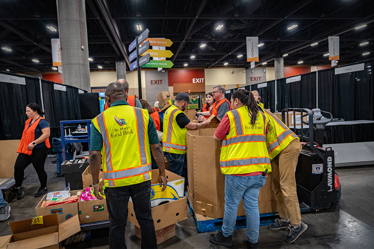 Volunteers filling boxes with donated food